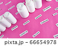 White plastic bottles with pills and coronavirus, pandemic headline clipping words 66654978