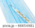 Mercurial thermometer and blue medical face mask 66654981