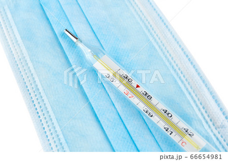 Mercurial thermometer and blue medical face mask 66654981