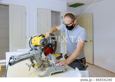 The worker is using personal protective equipments 66656280