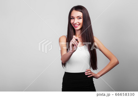 Cute businesswoman drawing with pen on virtual screen with copy space for text Cute businesswoman drawing with pen on virtual screen with copy space for text 66658330