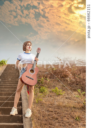 portrait of asian woman with guitar portrait of asian woman with guitar 66662151