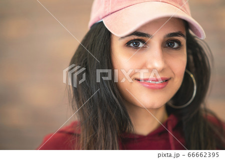 Happy  Smiling Beautiful Brunette Woman In Baseball Pink Cap With Long Hair Style In Fashion 66662395