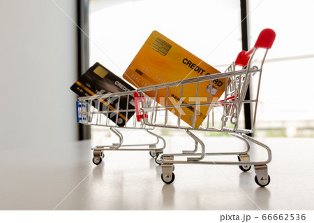 Photos of toys, trolleys, credit cards placed on a white table Shopping ideas online 66662536