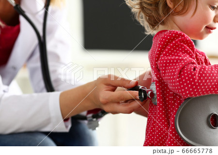 Little child with stethoscope at doctor reception Little child with stethoscope at doctor reception 66665778