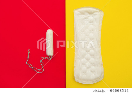Women intimate hygiene products - sanitary pad and tampon on colorful background 66668512