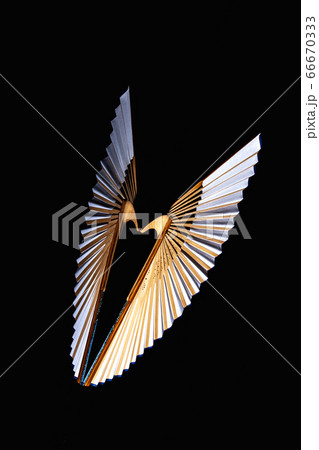 Bamboo open hand fan isolated on a black Bamboo open hand fan isolated on a black 66670333