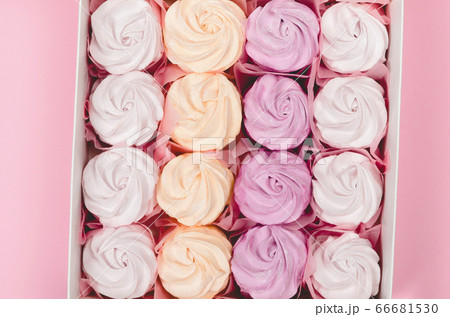 Color marshmallow in a gift box on pink 66681530