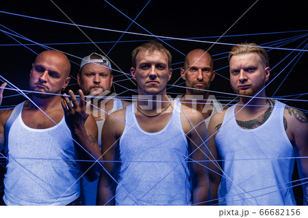 Group of men tangled in threads in ultraviolet 66682156