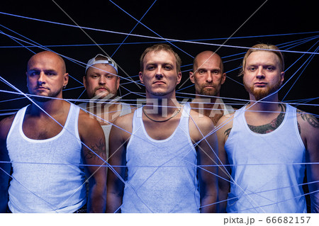 Image of group of men tangled in threads in ultraviolet Image of group of men tangled in threads in ultraviolet 66682157