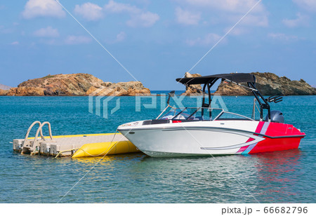 Blue sea and the boat floating on the sea. 66682796
