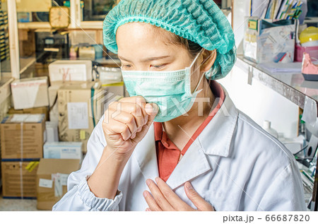Coronavirus covid 19 epidemic disease with doctor or lab technician scientist holding blood sample tube in laboratory in hospital Thailand 66687820