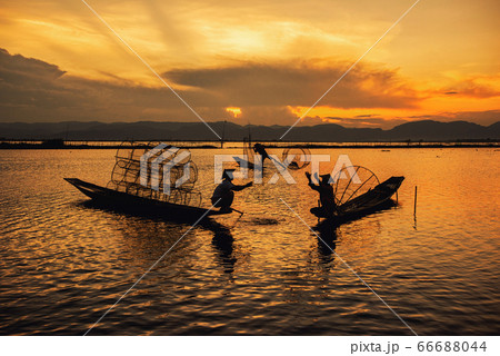 Intha Burmese fishermen on boat catching fish traditional at Inle Lake, Shan State, Myanmar 66688044
