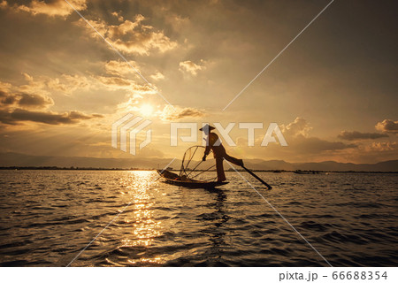 Intha Burmese fishermen on boat catching fish traditional at Inle Lake, Shan State, Myanmar Intha Burmese fishermen on boat catching fish traditional at Inle Lake, Shan State, Myanmar 66688354