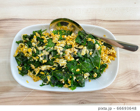 Stir-fried Malindjo leaves with egg on the table, this menu is favorite in the south of Thailand Stir-fried Malindjo leaves with egg on the table, this menu is favorite in the south of Thailand 66693648