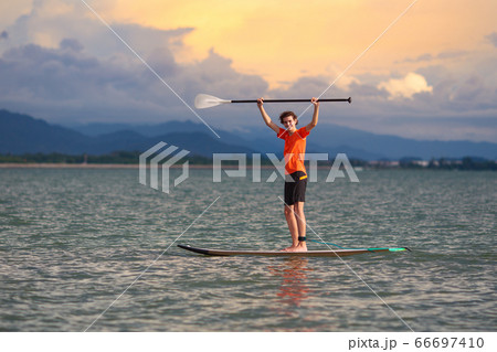 Man on stand up paddle. Water and beach sport 66697410