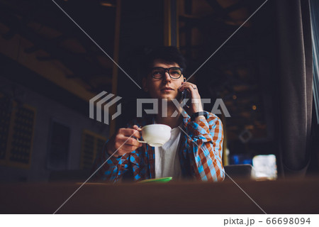 Portrait of positive smart student in trendy eyeglasses with black frame Portrait of positive smart student in trendy eyeglasses with black frame 66698094