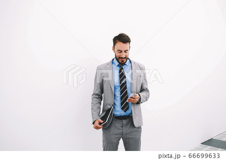 Serious male CEO is reading resume specialists before interview 66699633
