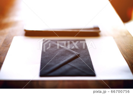 Workplace with open laptop with black screen on modern wooden desk 66700756