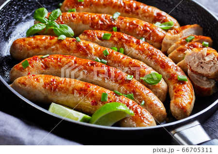 Close-up on fried sausage links on a skillet Close-up on fried sausage links on a skillet 66705311