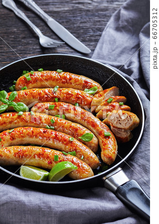 Fried pork sausage links of minced meat with basil Fried pork sausage links of minced meat with basil 66705312
