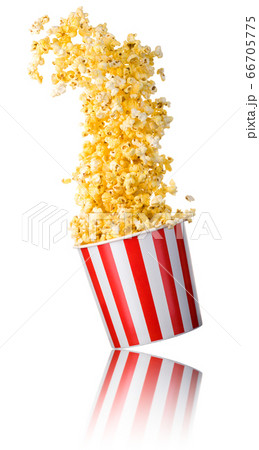 Flying popcorn from paper striped bucket isolated Flying popcorn from paper striped bucket isolated 66705775