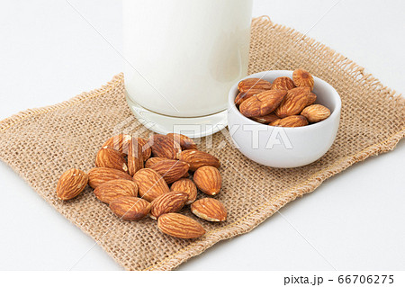 Milk Almonds in a glass on a white background 66706275