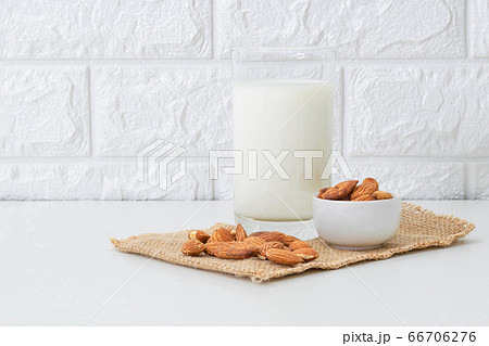 Milk Almonds in a glass on a white background 66706276