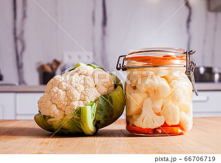 The fresh and pickled cauliflower in the kitchen The fresh and pickled cauliflower in the kitchen 66706719