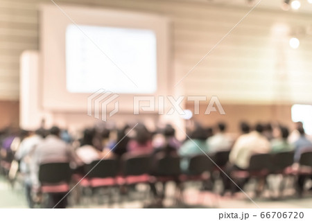 Seminar conference or town hall meeting blur background in auditorium or hotel room with audiences, speaker podium stage and presentation screen for entrepreneurship business speech or community talk 66706720