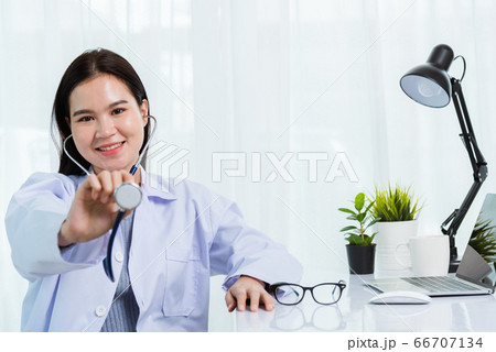 Female doctor at hospital office hand to hold show 66707134