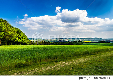Rural Landscape With Sunlit Clouds In Front Of The Skyline Of Vienna In Austria 66708613