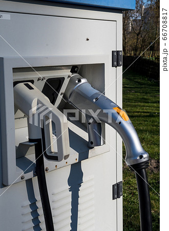 Plugs Of Power Cable Supply At Station For Electric Vehicle Charging Plugs Of Power Cable Supply At Station For Electric Vehicle Charging 66708817