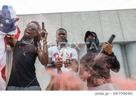 aggressive black people with guns in the streets 66709680