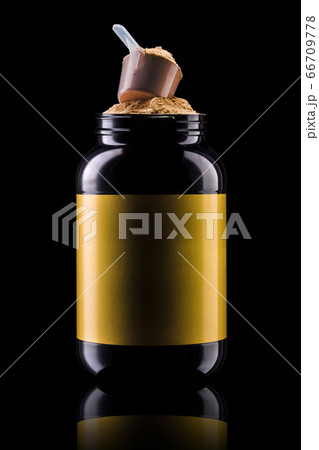 A scoop of chocolate protein powder drink in black A scoop of chocolate protein powder drink in black 66709778