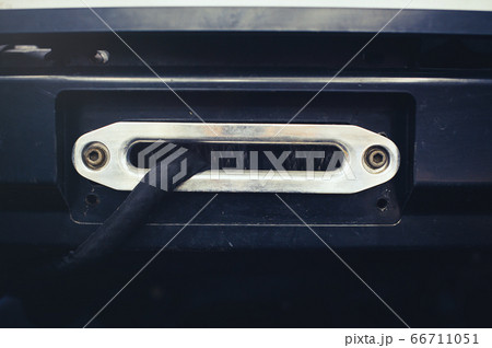 A towing winch with a clevis and a loop on a metal 66711051