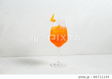 Fresh fruit yellow alcohol cocktail in wine glass Fresh fruit yellow alcohol cocktail in wine glass 66711144