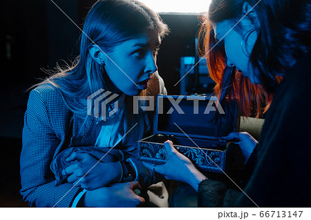 Woman and woman fortune teller with crystal ball Woman and woman fortune teller with crystal ball 66713147