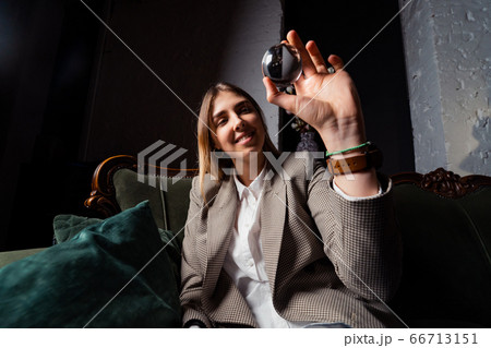 Woman in business suit holding crystal ball Woman in business suit holding crystal ball 66713151