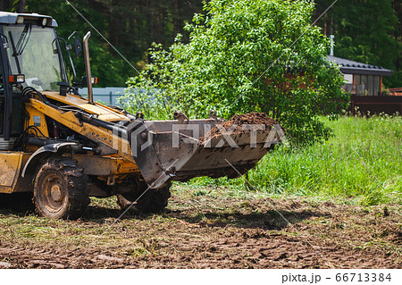 Clearing and leveling a private land plot. 66713384