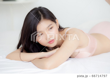 Beautiful portrait young asian woman sexy in underwear figure fit relax with seductive in bedroom. Beautiful portrait young asian woman sexy in underwear figure fit relax with seductive in bedroom. 66714797