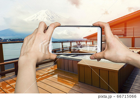 Girl taking pictures on mobile smart phone in Girl taking pictures on mobile smart phone in 66715066