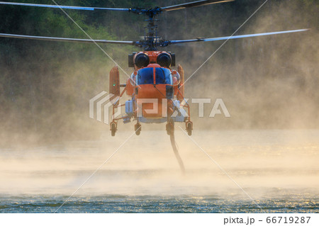 KA-32 Firefighting helicopter is hovering over the KA-32 Firefighting helicopter is hovering over the 66719287