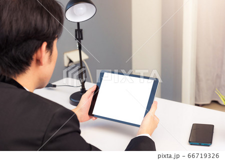 Back view of Businessman video conference by 66719326