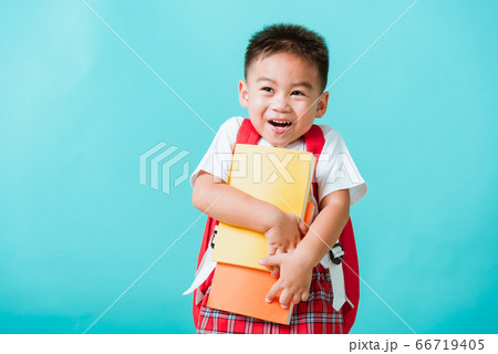 Kid from preschool kindergarten with book and 66719405