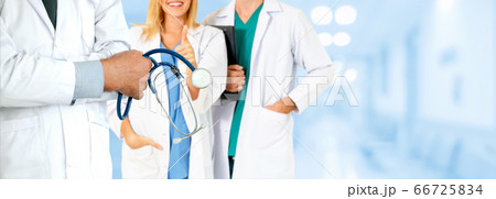 Doctor working in hospital with other doctors. 66725834