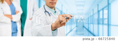 Doctor working in hospital with other doctors. 66725840