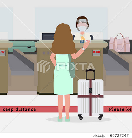 Woman wear green dress going to check in. 66727247