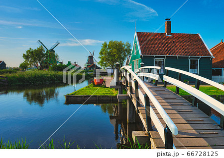 Bridge over canal at windmills at Zaanse Schans in Holland. Zaandam, Netherlands 66728125