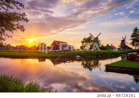 Windmills at Zaanse Schans in Holland on sunset. Zaandam, Nether 66728161